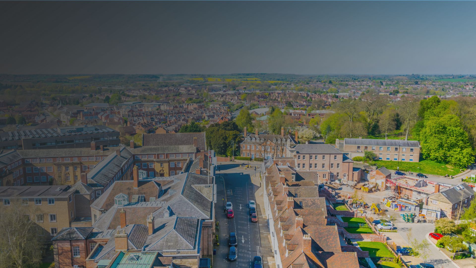 Aerial view of a typical British suburban neighbourhood with red brick homes